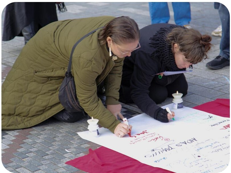 Signing a sheet at National Animal Rights Day